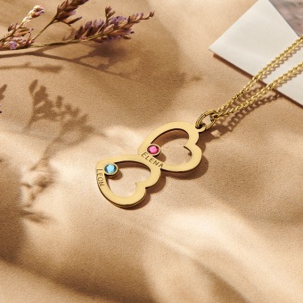 Gouden familie hanger met twee harten en geboortestenen