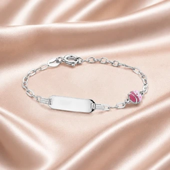 Zilveren kinderarmband met roze lieveheersbeestje en gravure
