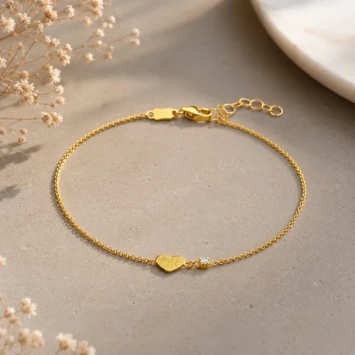 Gouden armband met vingerafdruk op hartje en diamant