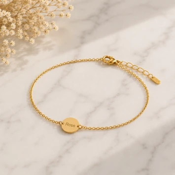 Gouden armband met ronde vingerafdrukbedel