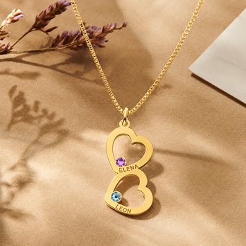 Gouden familie hanger met twee harten en geboortesteen