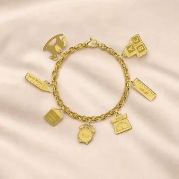 Gouden geboorte armband met losse bedels