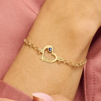 Gouden hartjesarmband met steentje