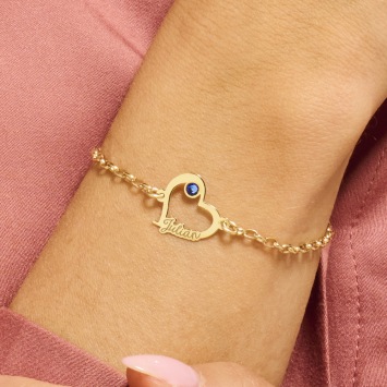 Gouden hartjesarmband met steentje