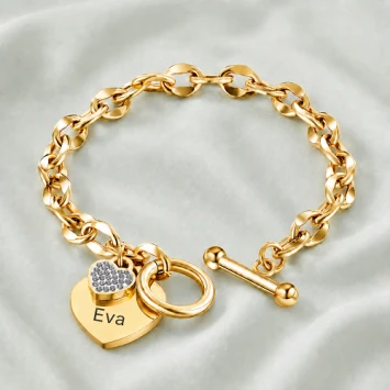 Gouden RVS armband met groot hart en klein hart met steentjes