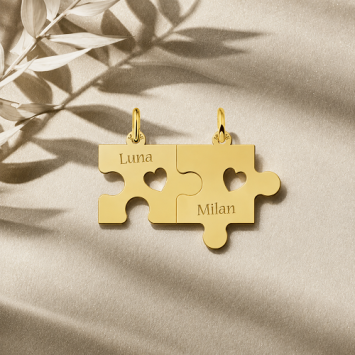 Koppel hanger puzzel met open harten Goud