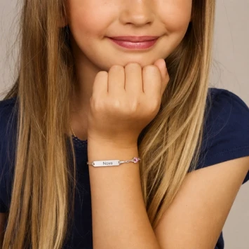 Zilveren kinderarmband met klavertje vier roze