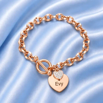Rosé RVS armband met groot hart en klein hart met steentjes