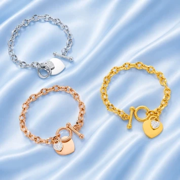 Rosé RVS armband met groot hart en klein hart met steentjes