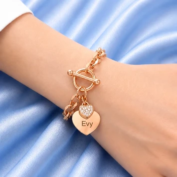 Rosé RVS armband met groot hart en klein hart met steentjes