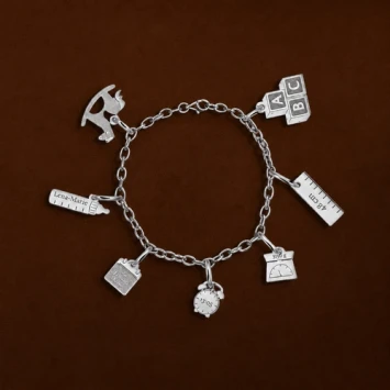 Zilveren geboorte armband met losse bedels