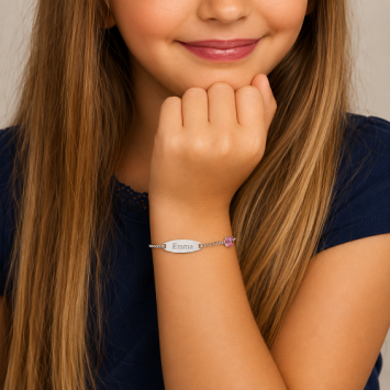 Zilveren kinderarmband met klavertje vier roze ovaal