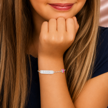 Zilveren kinderarmband met lieveheersbeestje roze